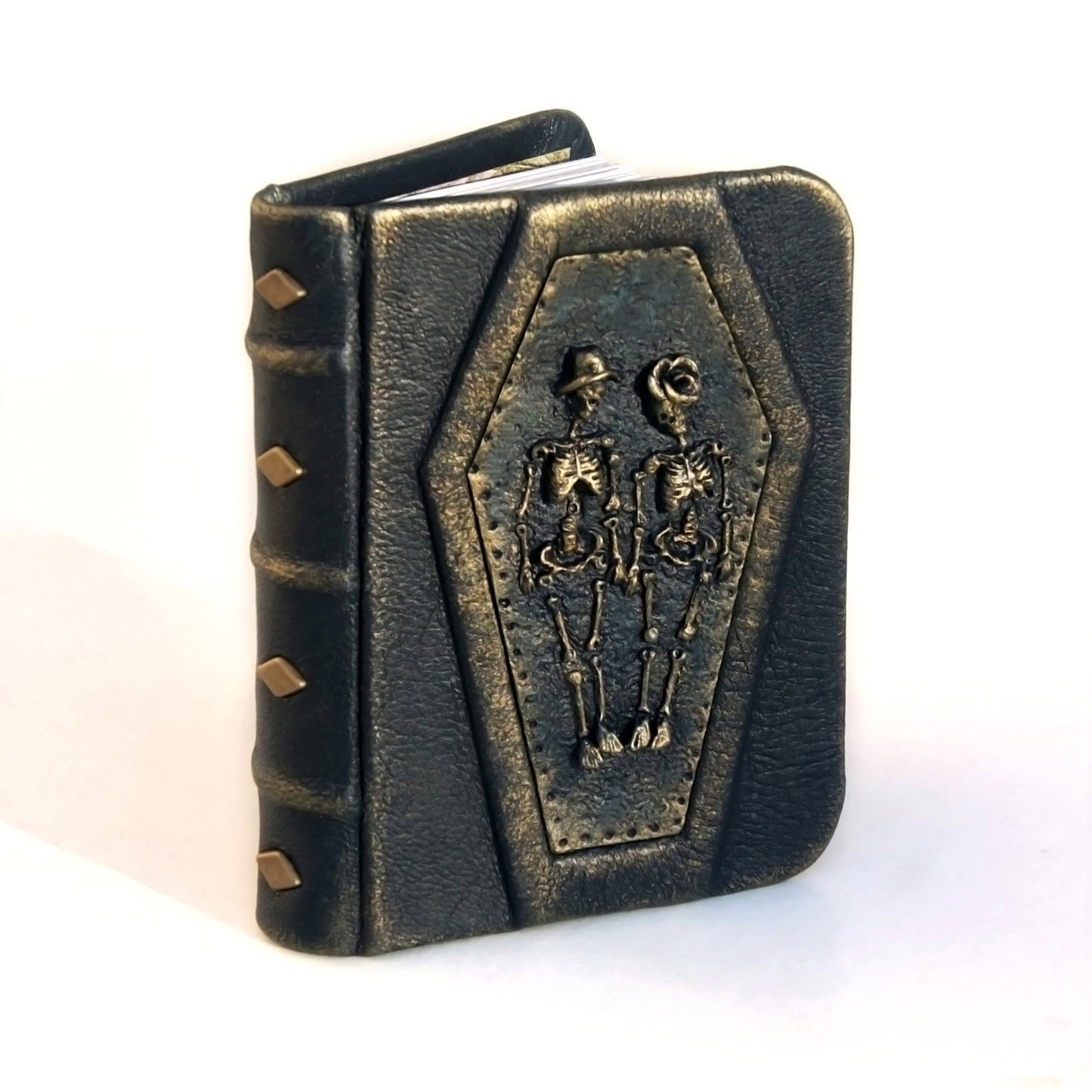 pocket size leather journal with 3D skeletons on the cover