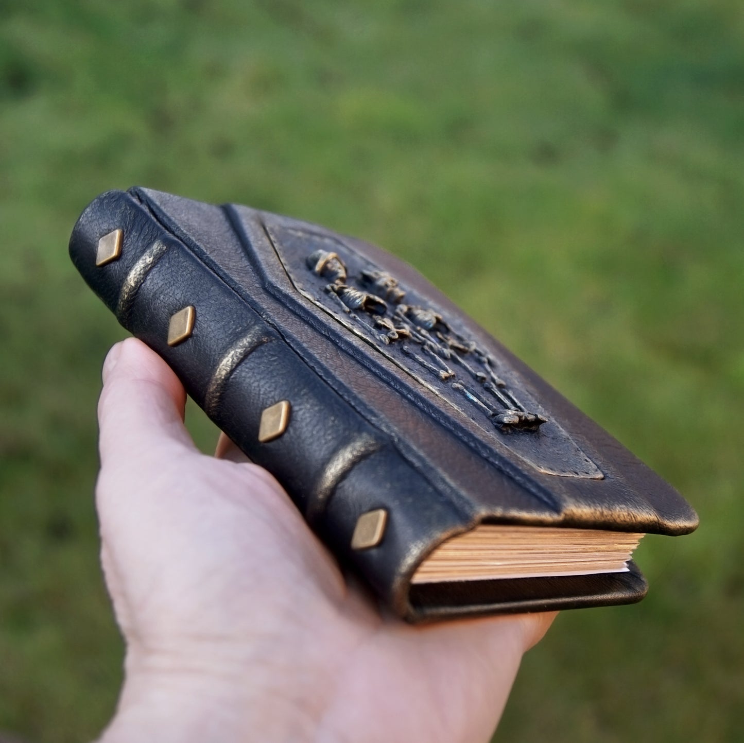 A7 pocket size notebook genuine leather, dark blue, skeleton on th hard cover