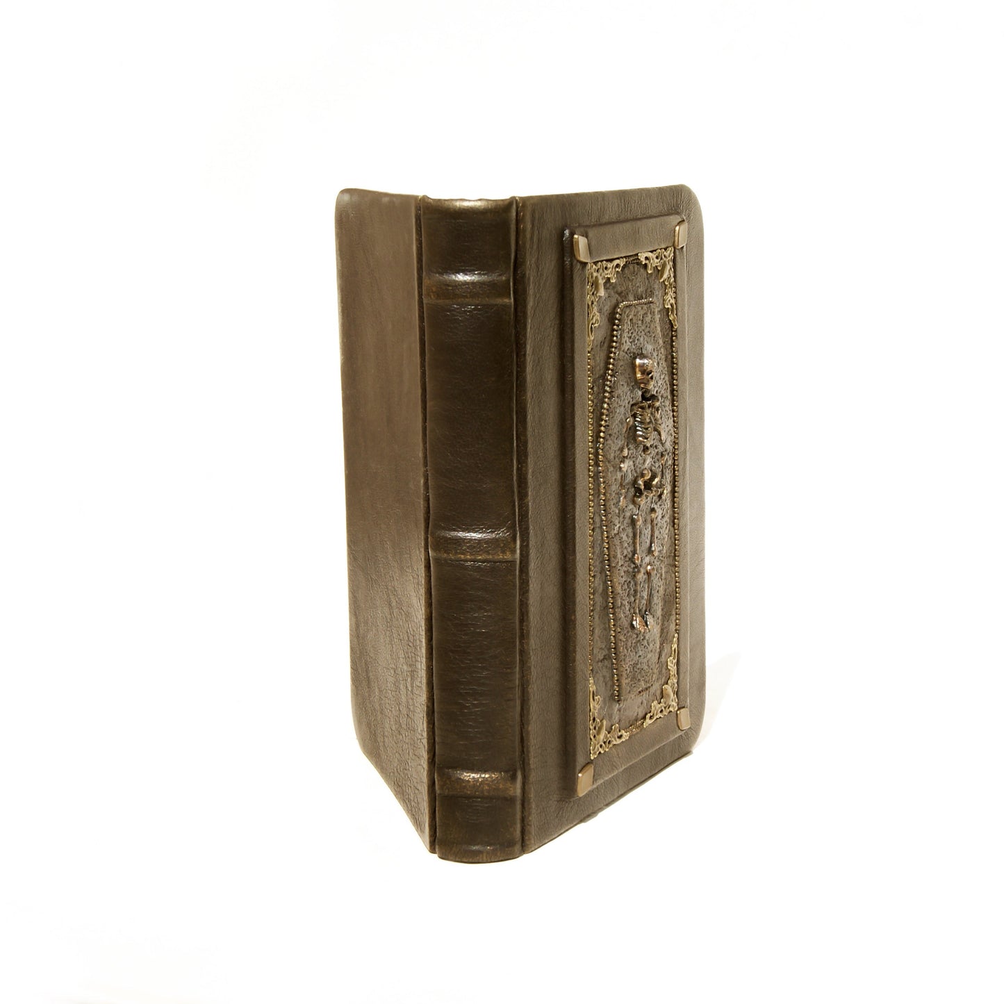 Decorative bronwn book with intricate design on a white background
