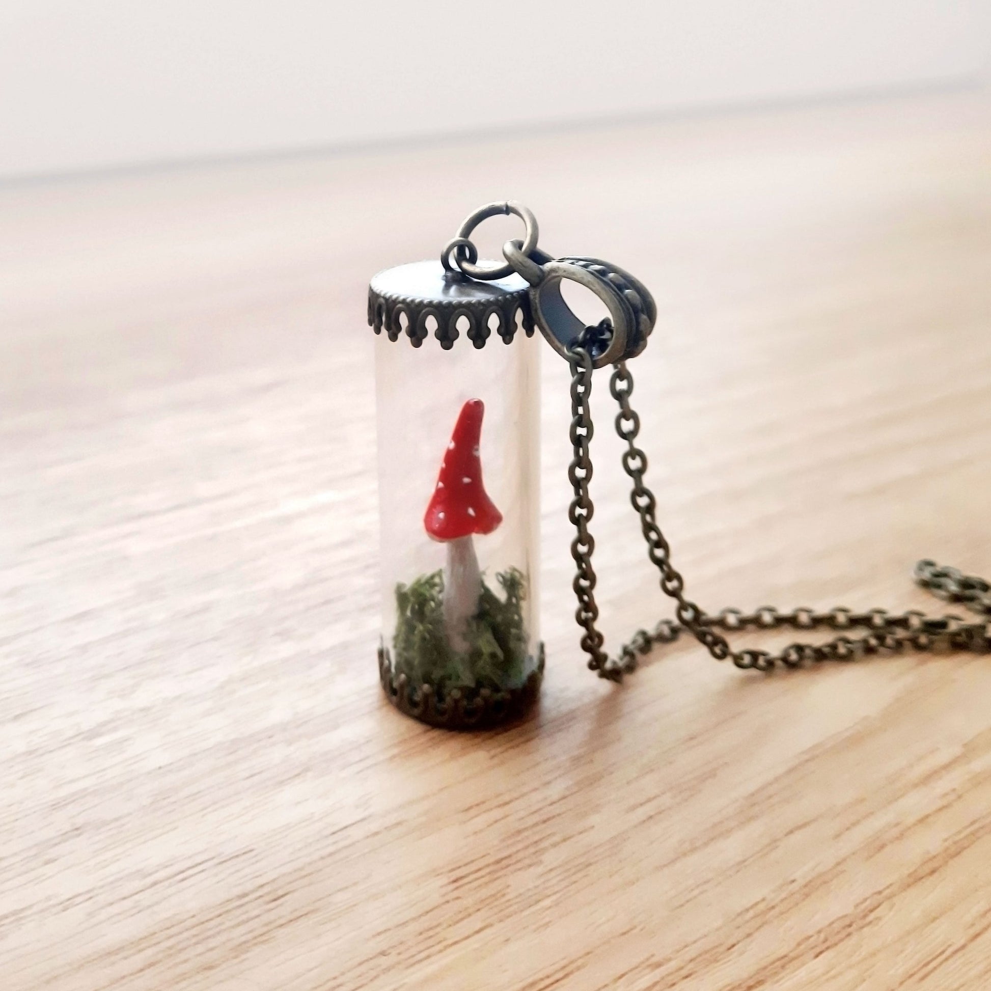 Mini terrarium necklace, consisting of of real preserved moss and polymer clay mushroom. Chain color - antique bronze.  Pendant height 3cm (1.2")