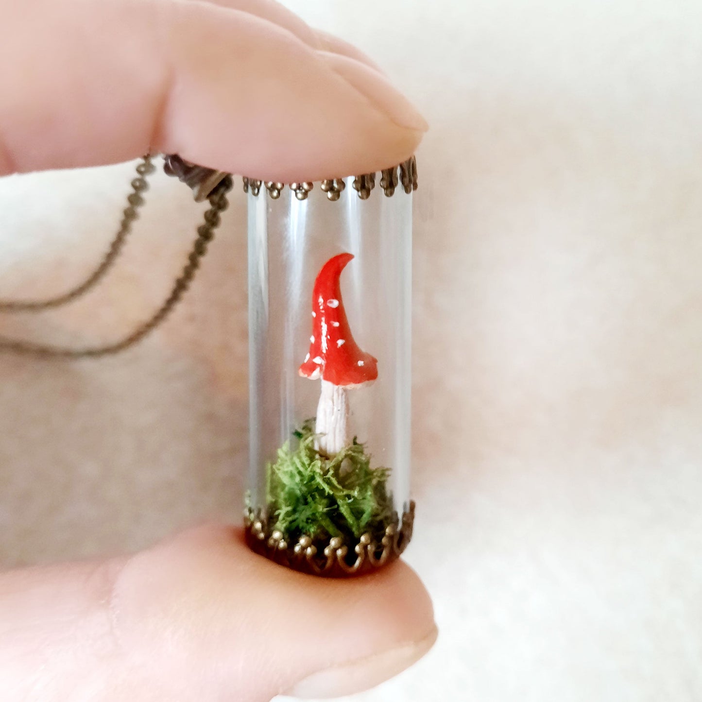 Mini terrarium, consisting of of real preserved moss and polymer clay mushroom. Chain color - antique bronze Pendant height 3cm (1.2")