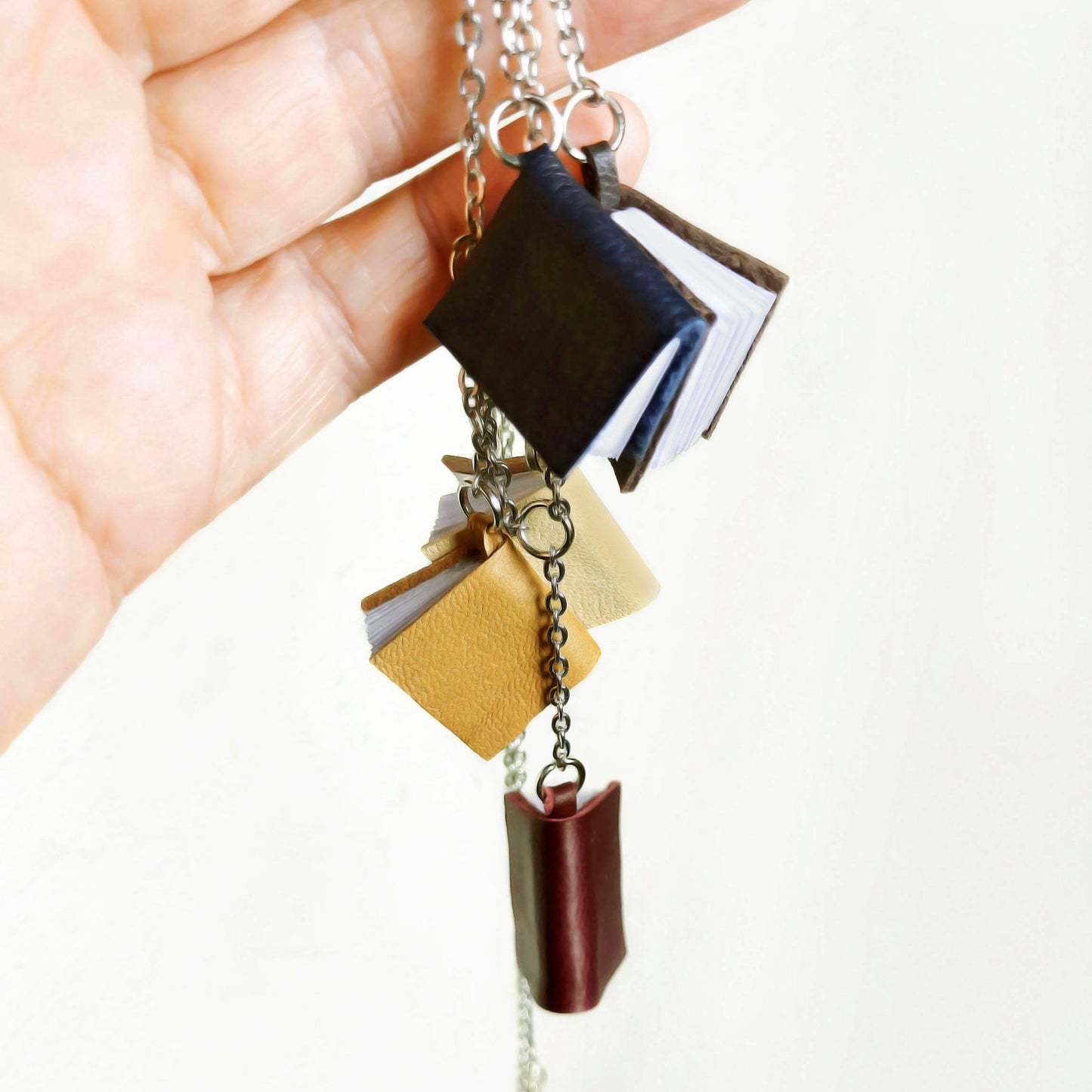  5 mini leather books on a chain, 1,5 cm