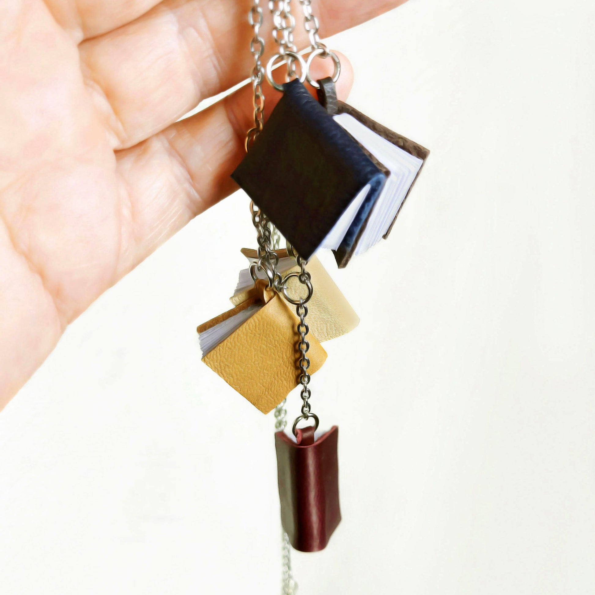  5 mini leather books on a chain, 1,5 cm