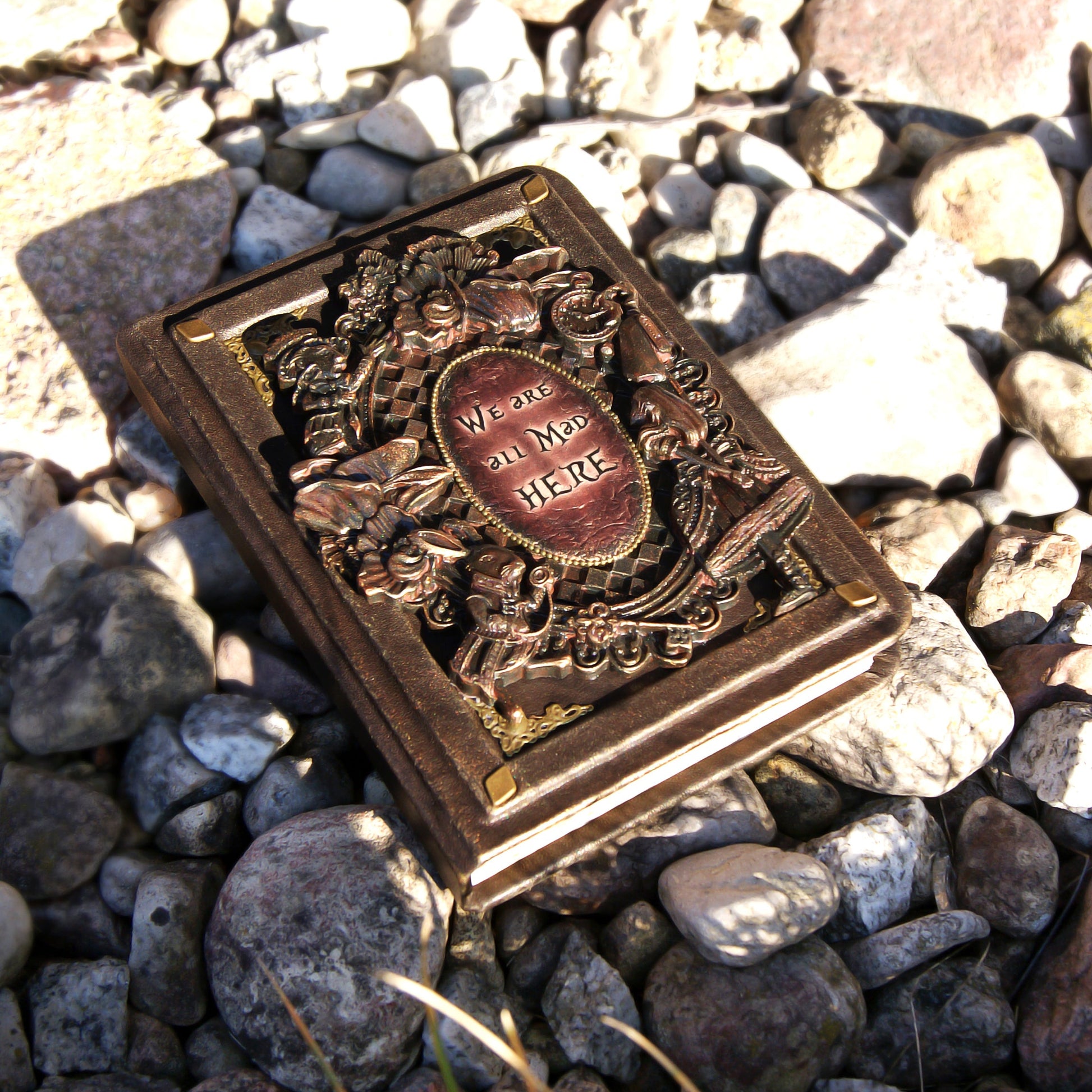 Custom leather journal with insert of polymer clay. Alice in Wonderland on the cover and the inscription "We are all mad here".