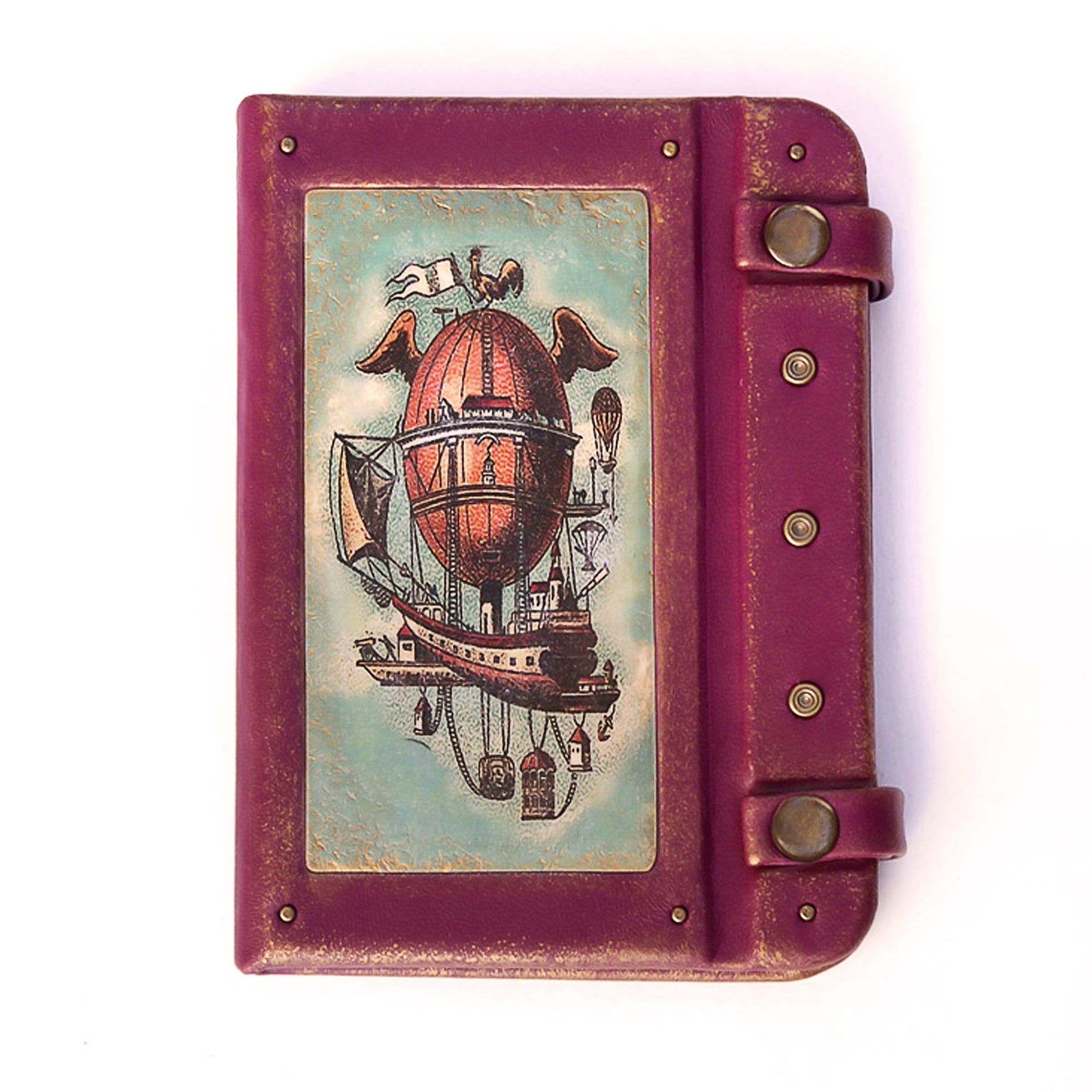 Purple leather-bound book with a steampunk airship illustration on the cover