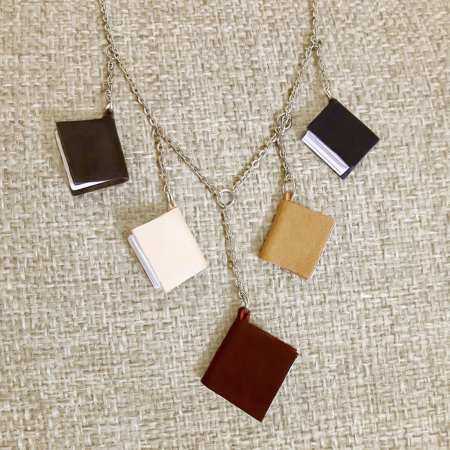 Necklace, 5 mini leather books on a chain
