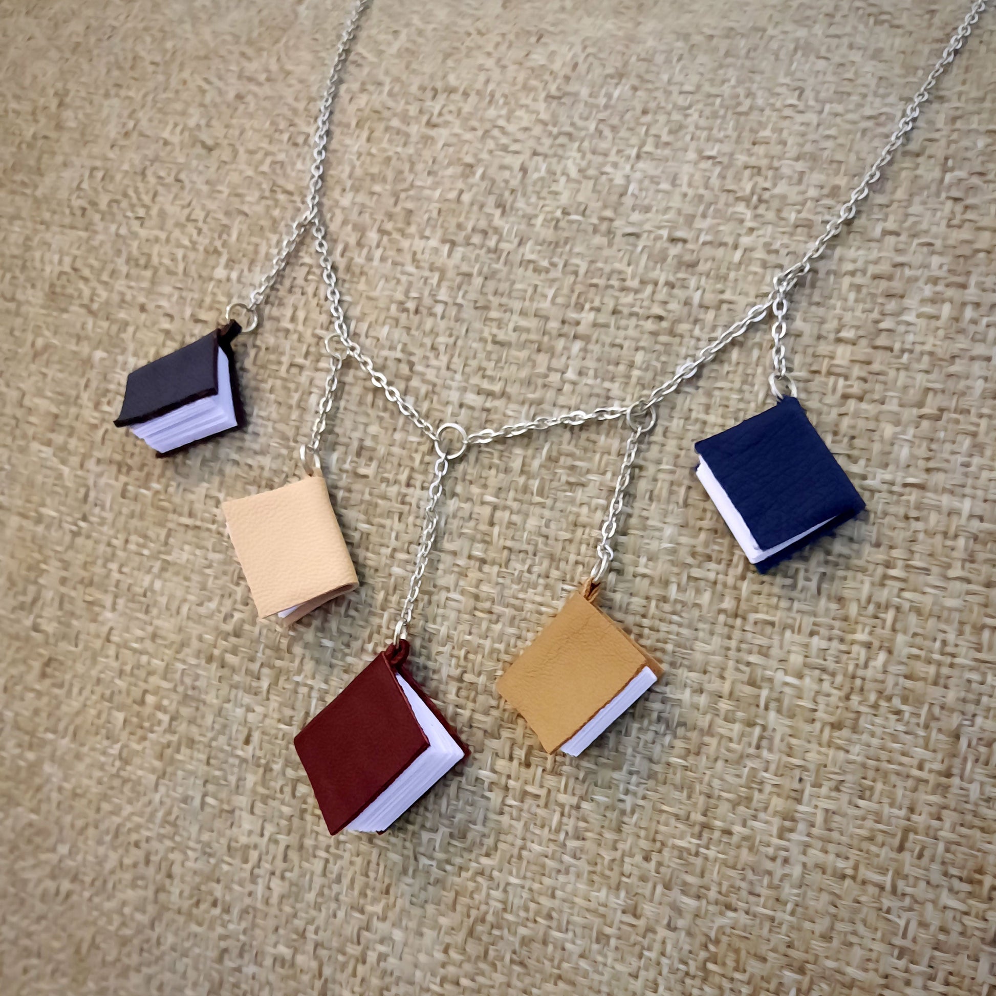 Necklace, 5 mini leather books on a chain