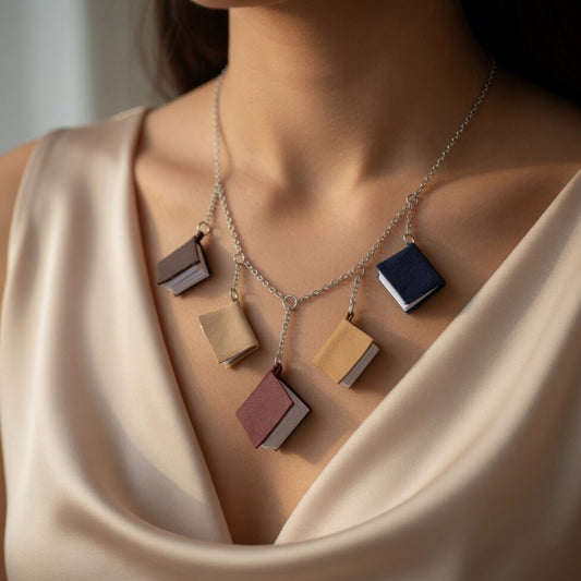 Necklace, 5 mini leather books on a chain on the model